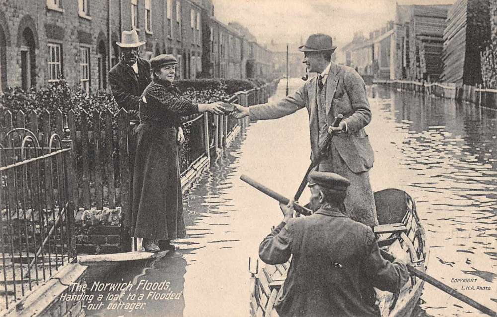 Norwich England Flood Disaster Handing a Loaf of Bread from Boat PC JE359962