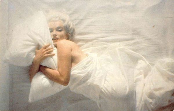 Marilyn Monroe movie actress posing with pillow and sheet vintage pc ZC549358