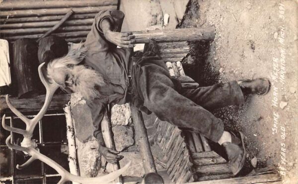 Harrison Michigan Spikehorn Meyers on Log Bench Real Photo Postcard AA63895