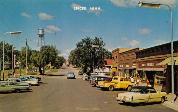 Spicer Minnesota View of town leading to High School Vintage Postcard U648