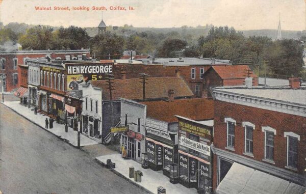 Colfax Iowa Walnut Street looking South Stores and Restaurants Vintage PC U1375
