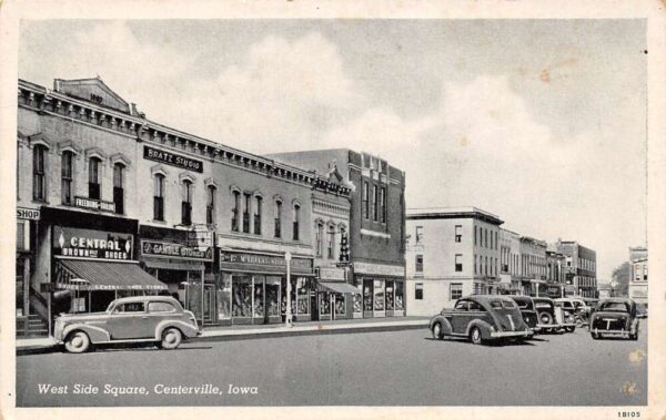 Centerville Iowa West Side of Square Shops and Cars Vintage Postcard U1376