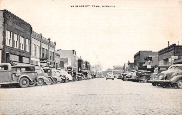 Tama Iowa Main Street Shops and Cars Vintage Postcard U1396