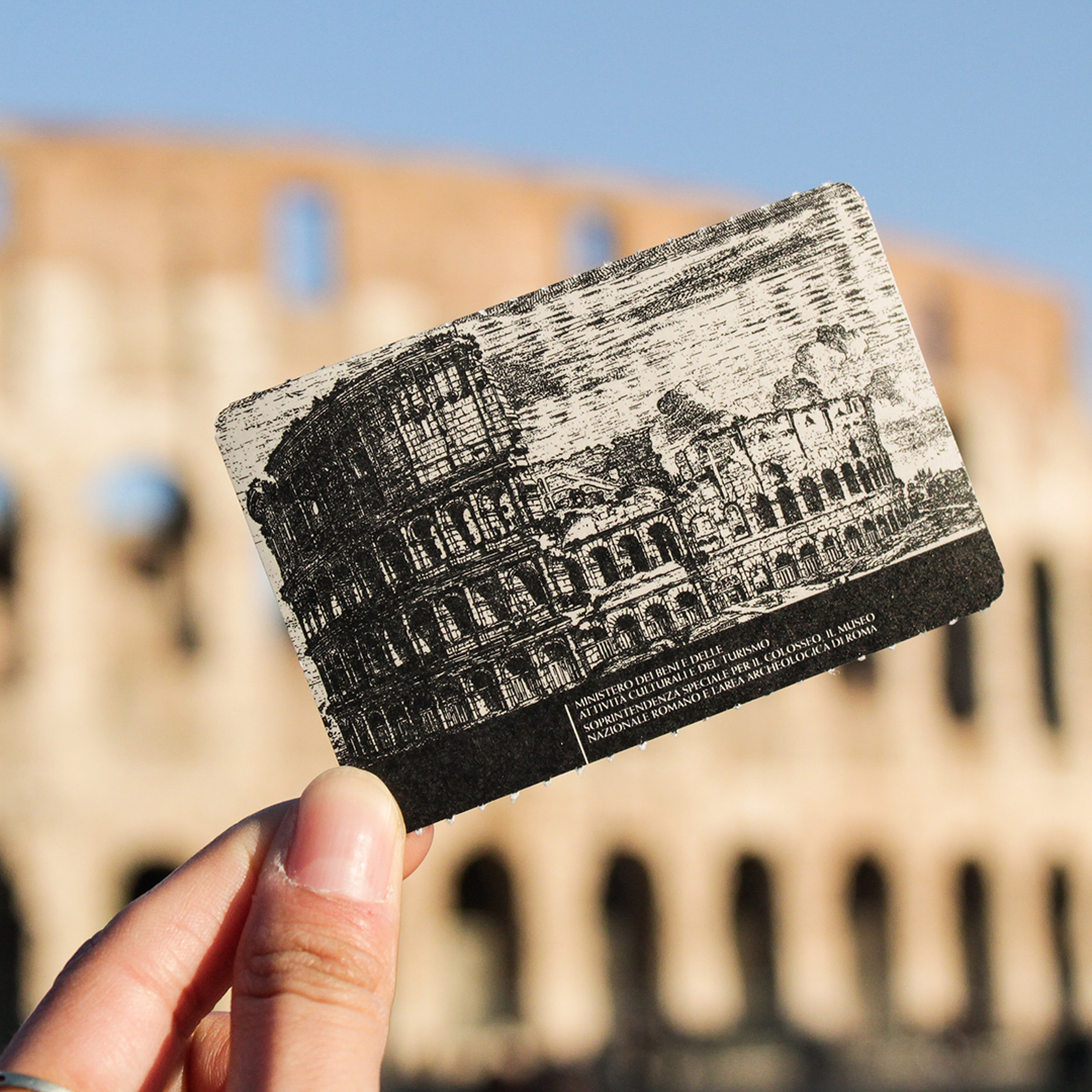 woman holding up a historical postcard