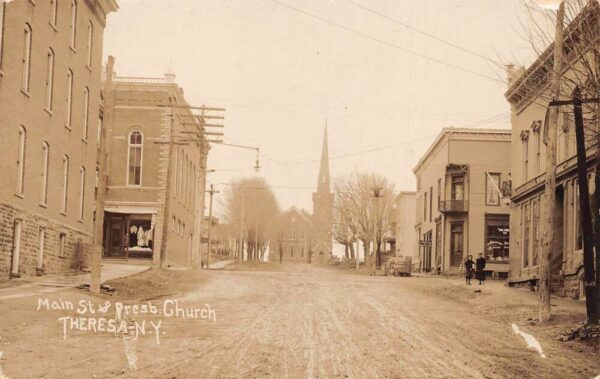 Theresa New York Main Street and Presbyterian Church Real Photo Postcard AA65586
