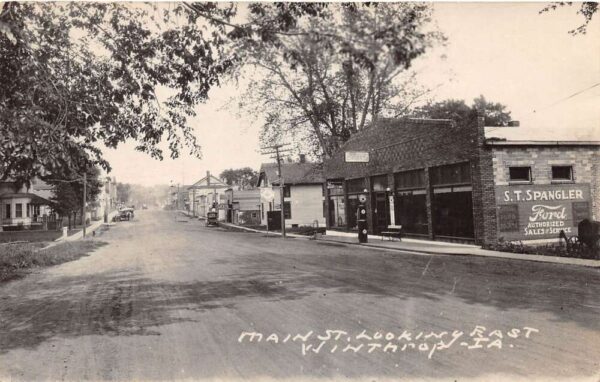 Winthrop Iowa Main Street Ford Car Dealership Real Photo Postcard AA69054