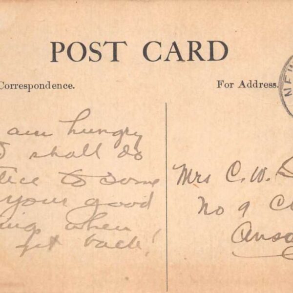 Writing on the back of a vintage postcard