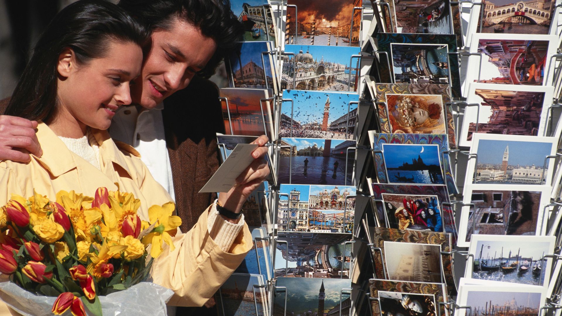 vintage photograph of a couple shopping for postcards