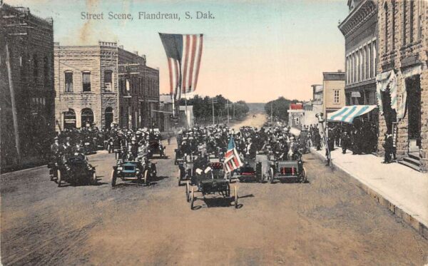 Flandreau South Dakota Parade Scene Cars Automobiles USA Flag Postcard AA94254