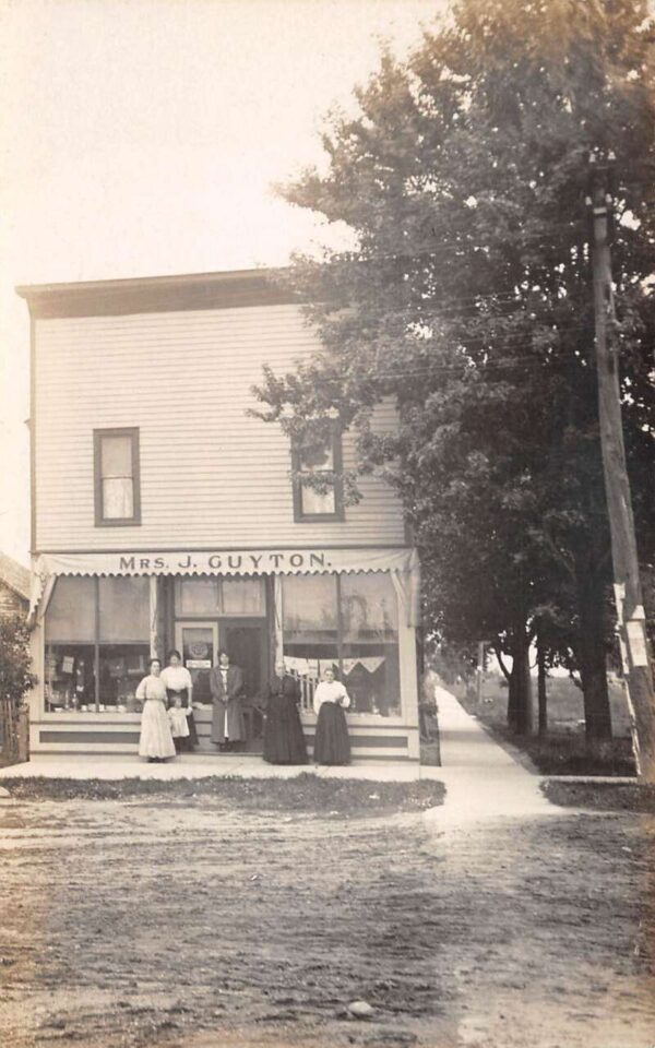 Mrs. J Guyton Shop Exterior and Employees Real Photo Vintage Postcard AA92424