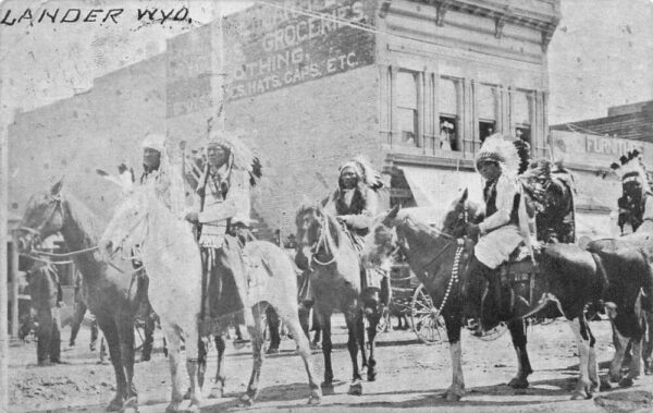 Lander Wyoming Native American Indians on Horses in Street Postcard AA92435