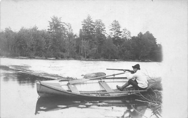 Hunting Scene Hunter Aiming Gun in Canoe Real Photo Vintage Postcard AA98866