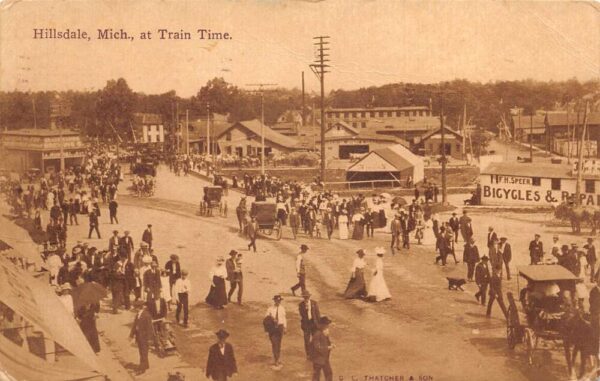 Hillsdale Michigan Crowd Heading to Train Station Bicycle Shop Postcard AA87835