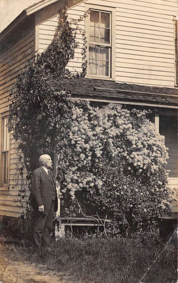 Ferry Michigan Man by Flowering Vine on House Real Photo Postcard AA89191