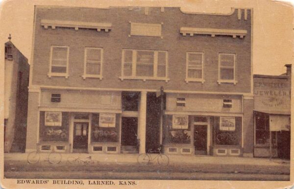 Larned Kansas Edwards Building Bicycles Jewelry Store Vintage Postcard AA89803