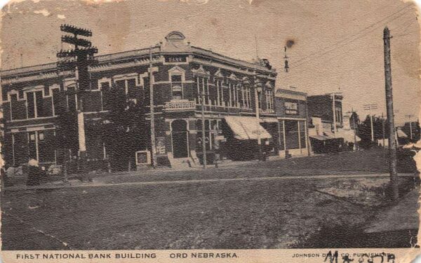 Ord Nebraska First National Bank Street Scene Vintage Postcard AA101449