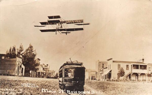 Bowdon North Dakota Main Street Trolley and Airplane Real Photo PC AA101744