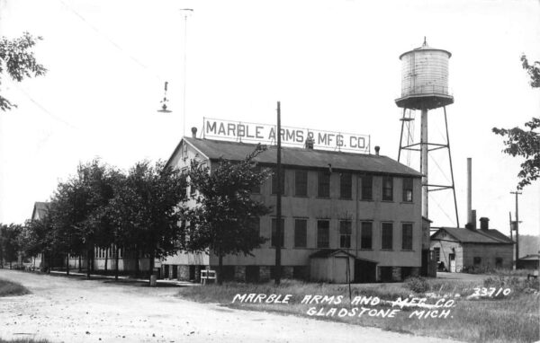 Gladstone Michigan Marble Arms and MFG Co Water Tower Real Photo PC AA102257