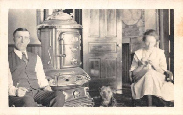 Man and Woman with Dog by Cast Iron Stove Real Photo Vintage Postcard AA102819